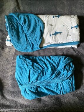 Kyte Baby blue crib sheets and shark blanket set.